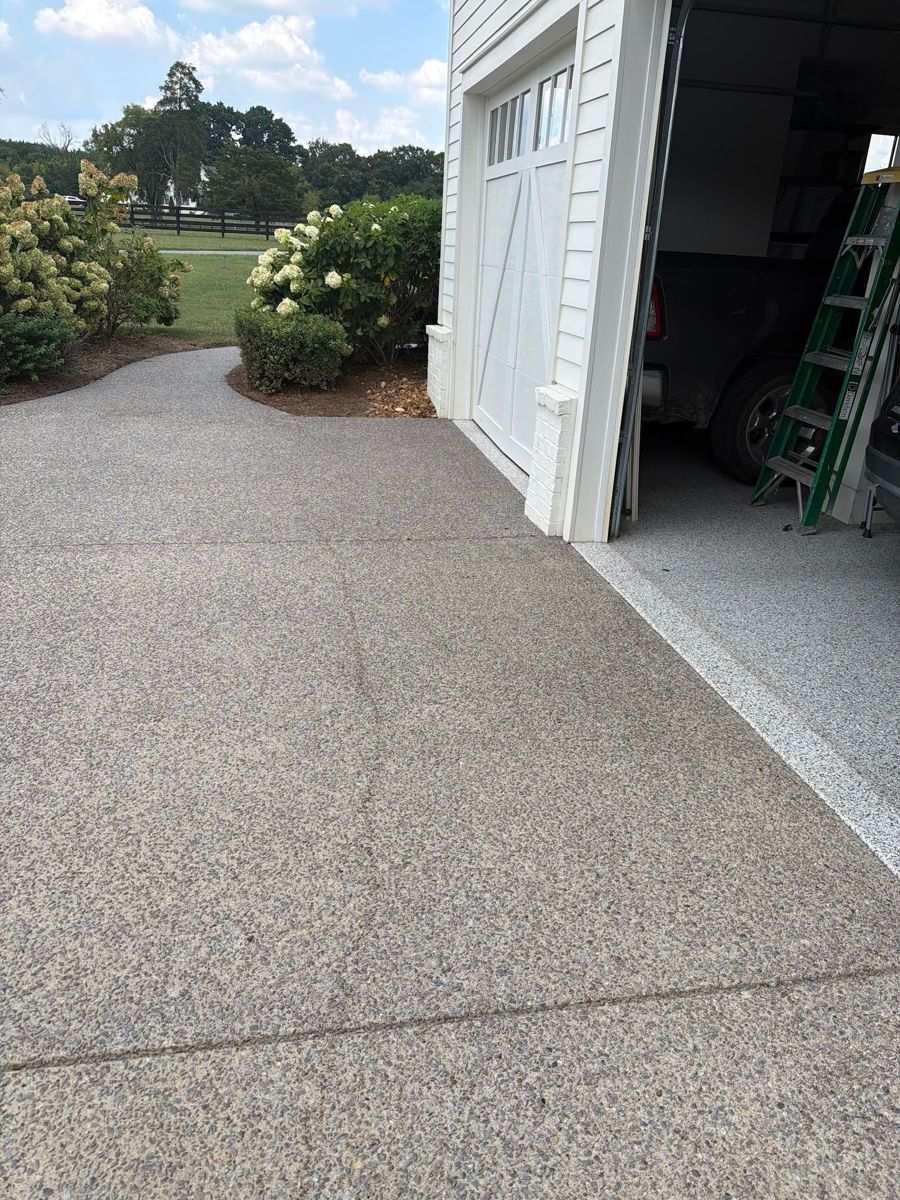 Flat concrete transition at a garage door in Franklin TN, the section that gets cut back and rebuilt for a paver overlay