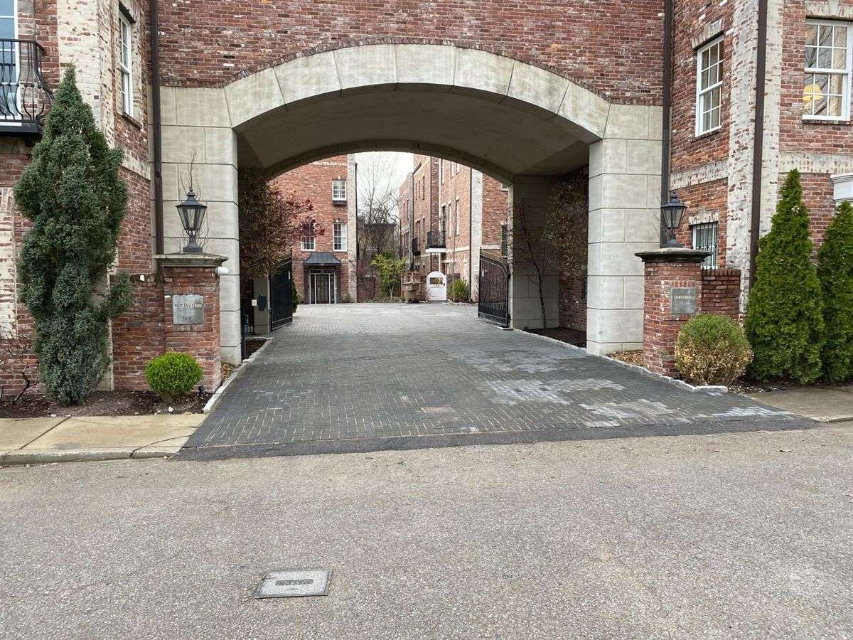 Finished Holland Stone paver overlay driveway with soldier-course border in Nashville
