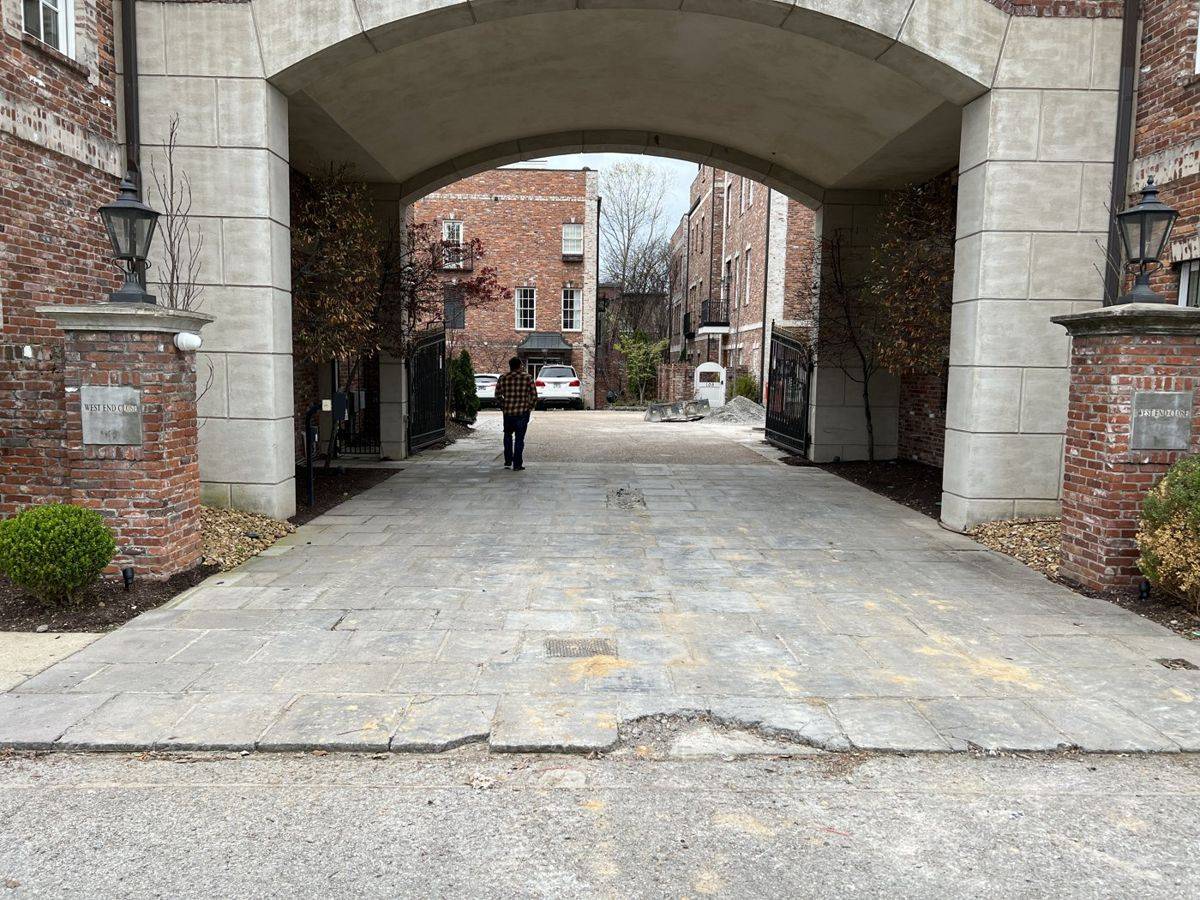 Cracked concrete driveway in Nashville before Holland Stone paver overlay