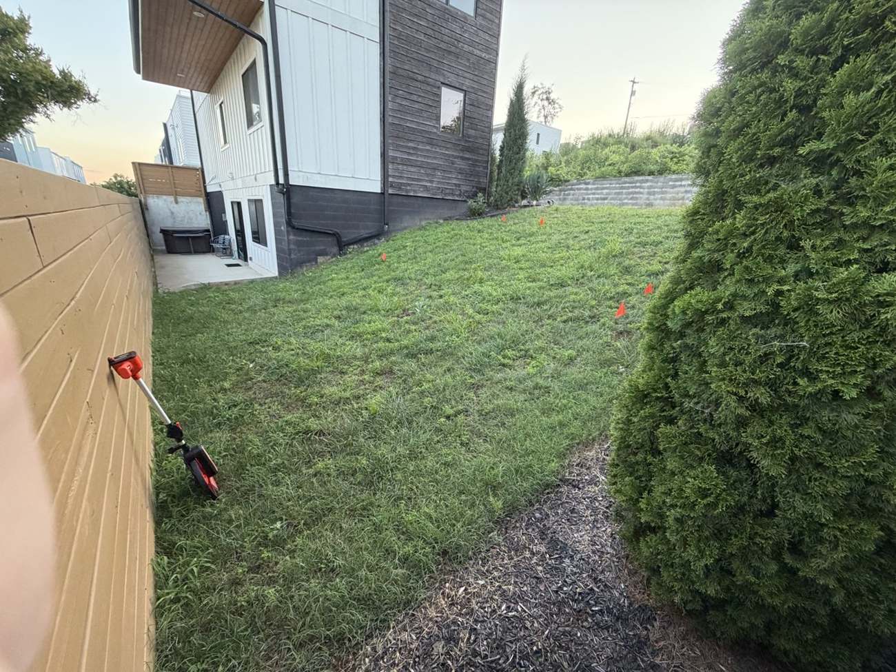 Lower yard falling to the rear fence in Bordeaux Nashville before retaining walls