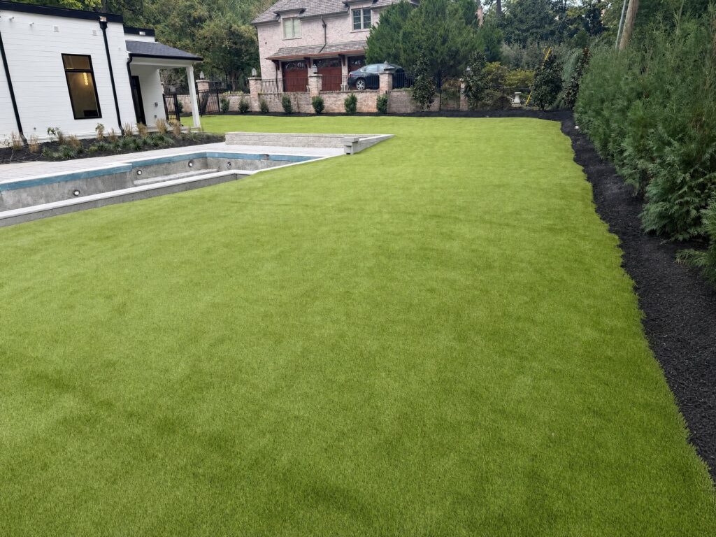 Synthetic turf lawn beside a new pool in a West Meade, Nashville back yard